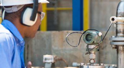Operator at a chemical plant. Experts can help optimize your process by improving bleaching and chemical efficiency.