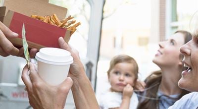 Woman receiving take away from a food truck. The high compressibility of Expancel microspheres ensures resilient seals for food packaging. 