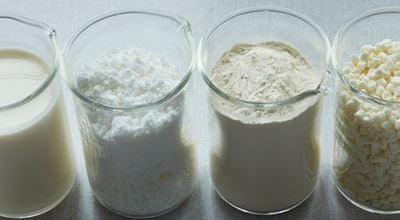 Four product samples in beakers with Expancel unexpanded microspheres used as blowing agents, expanding up to 60 times in volume. 