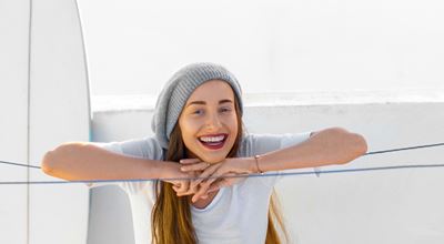 Lady on roof top. Elastomeric cool roof coatings