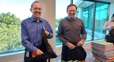 Nouryon employees filling backpacks with essential school supplies