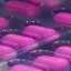 Pink pills aligned in pharmaceutical production