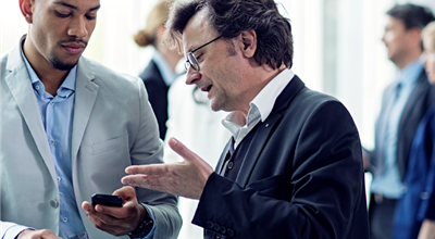 Two men discussing ethical business behavior and sourcing